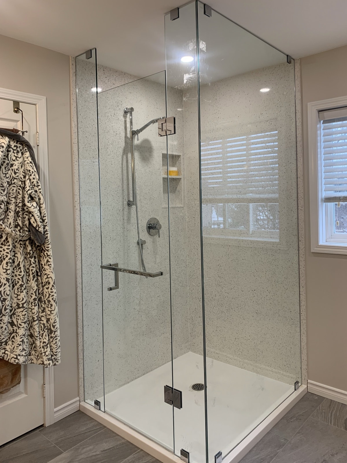 Complete with plumbing fixtures & frameless shower glass.